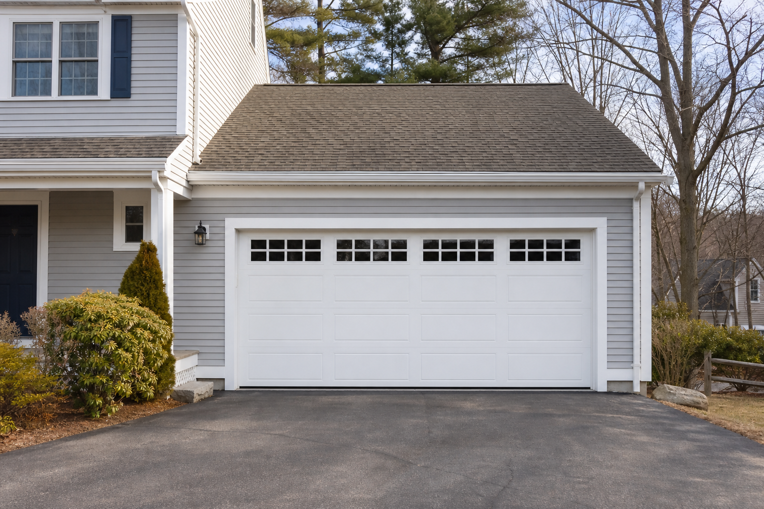 Quiet suburban garage exterior in Sharon, MA with the garage door fully visible